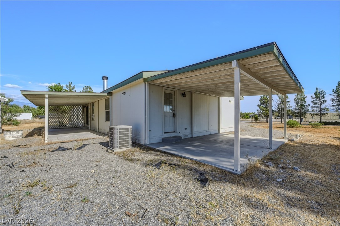 1890 West Dyer Road Pahrump, NV 89048 - Photo 11 of 40 This outdoor space offers a covered patio and direct access to the home.
