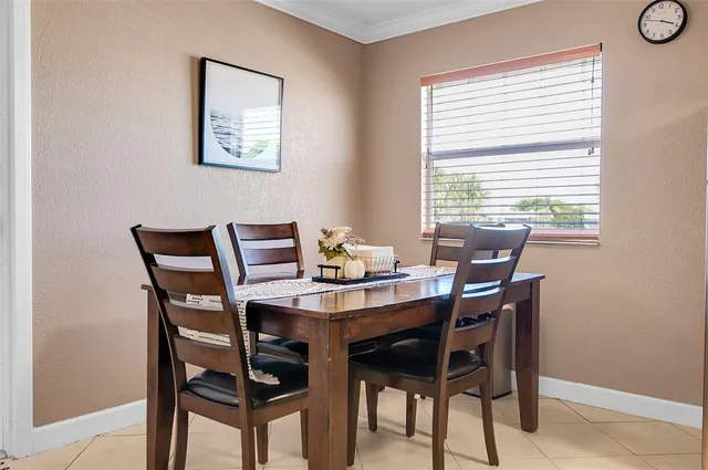 a dining room with furniture and window