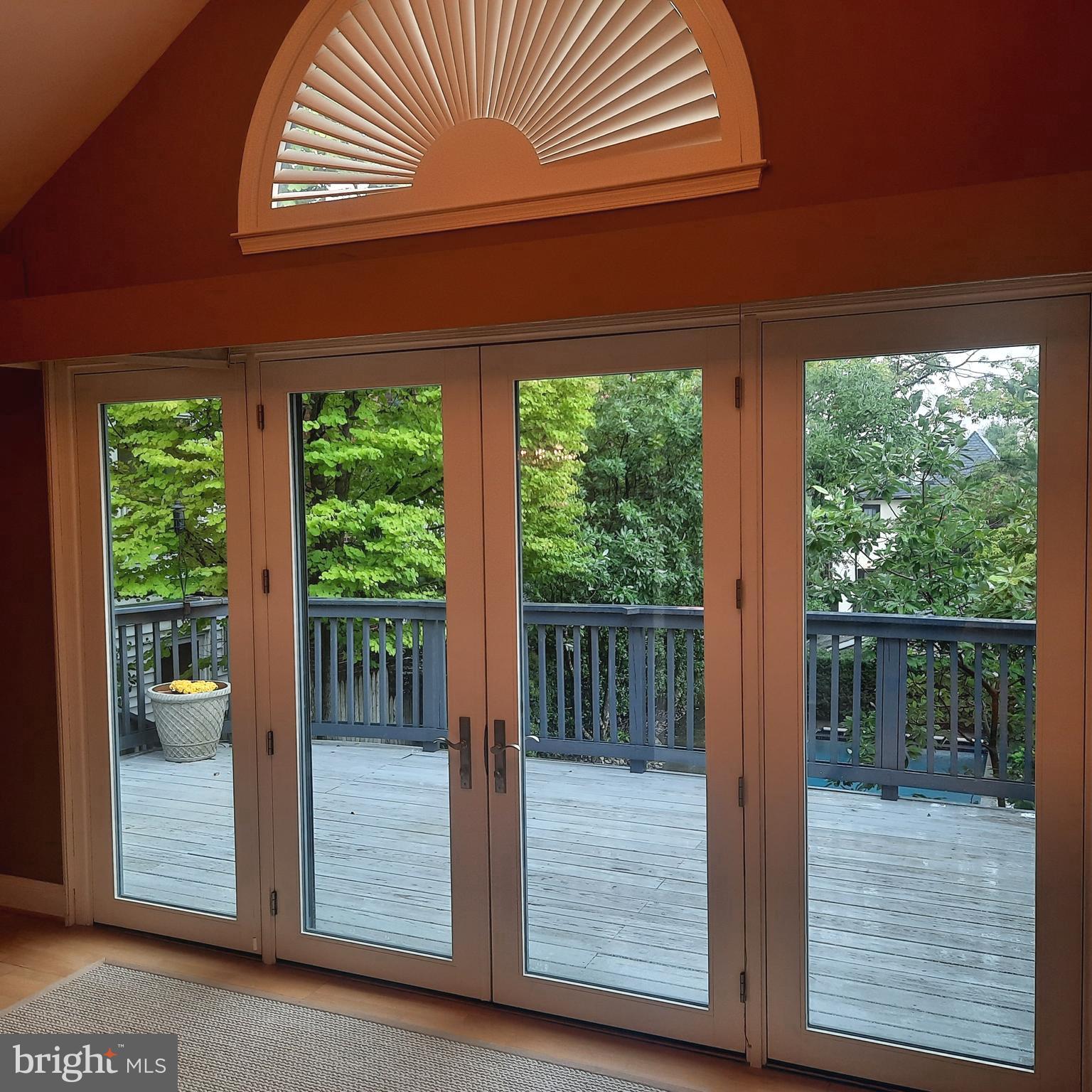 2818 38th Street Northwest Washington, DC 20007 - Photo 16 of 43 Sun room with new window wall and 13 ft ceiling