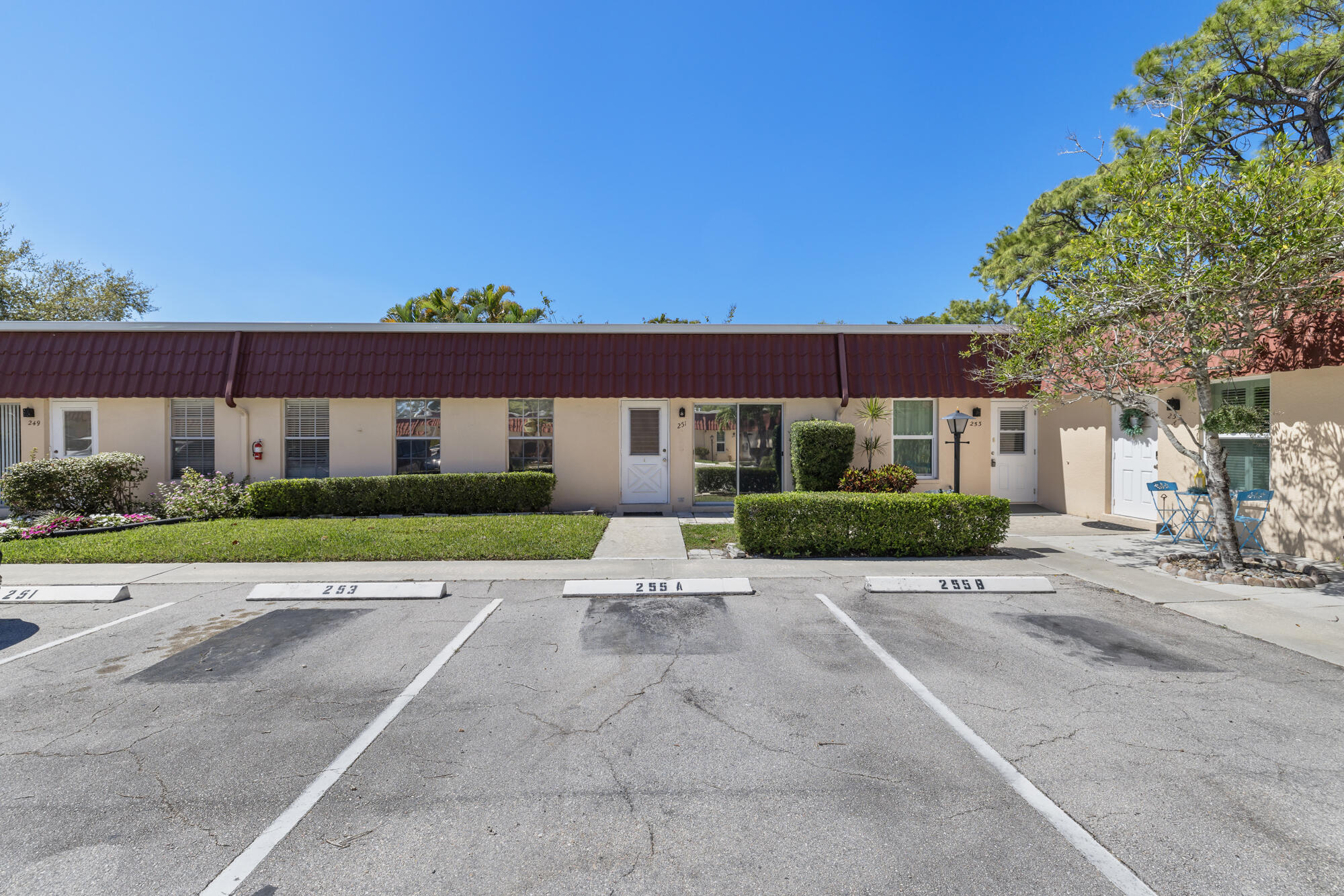 251 Down E Lane Lake Worth, FL 33467 - Photo 1 of 22 front view of house with a yard