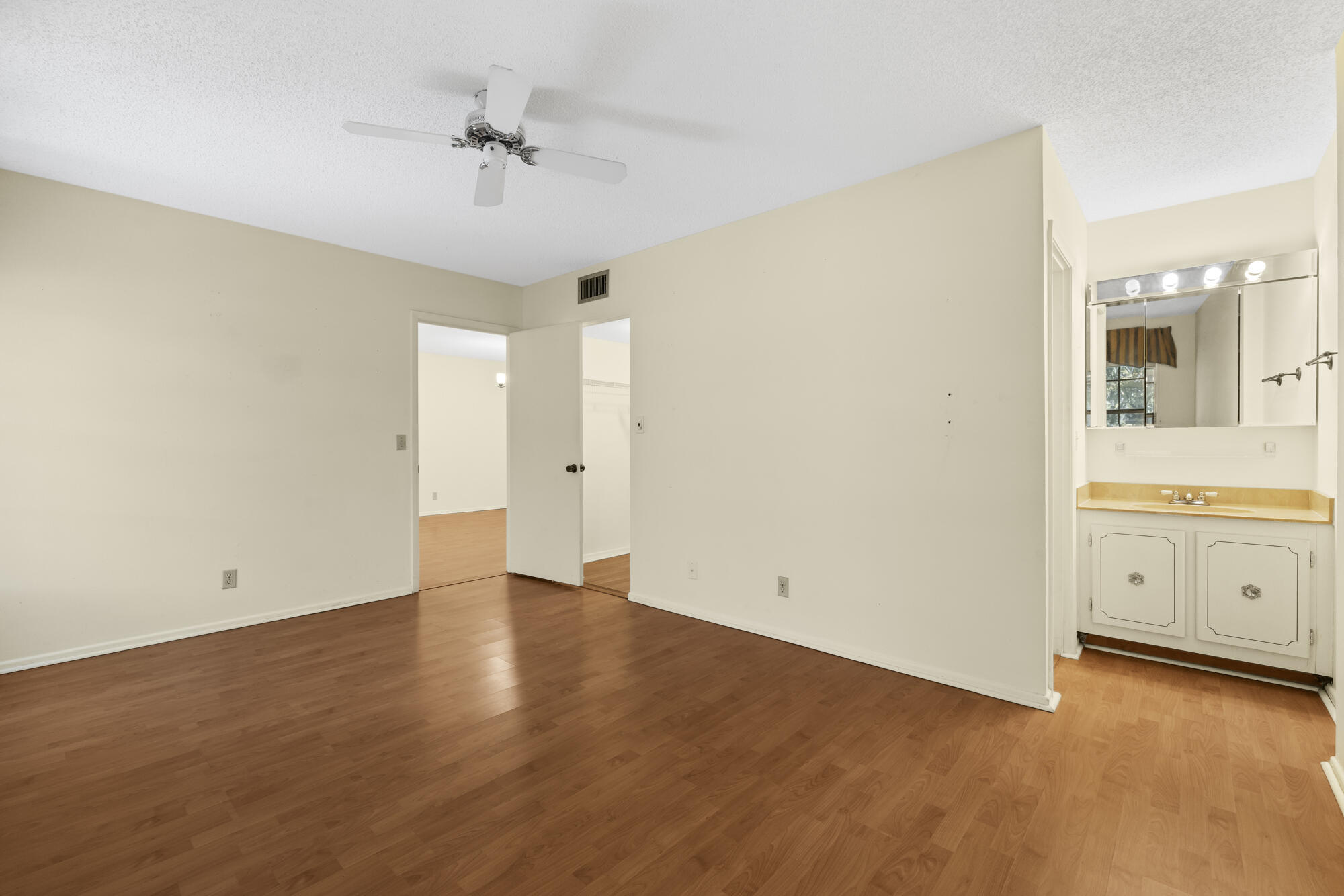 251 Down E Lane Lake Worth, FL 33467 - Photo 10 of 22 an empty room with a bathroom and a sink