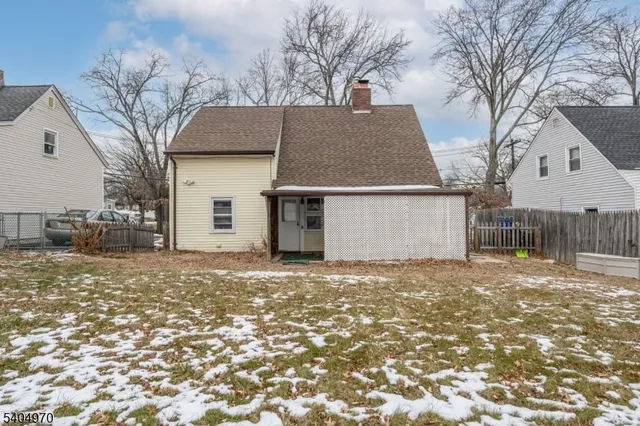 a view of a house with a yard and garage