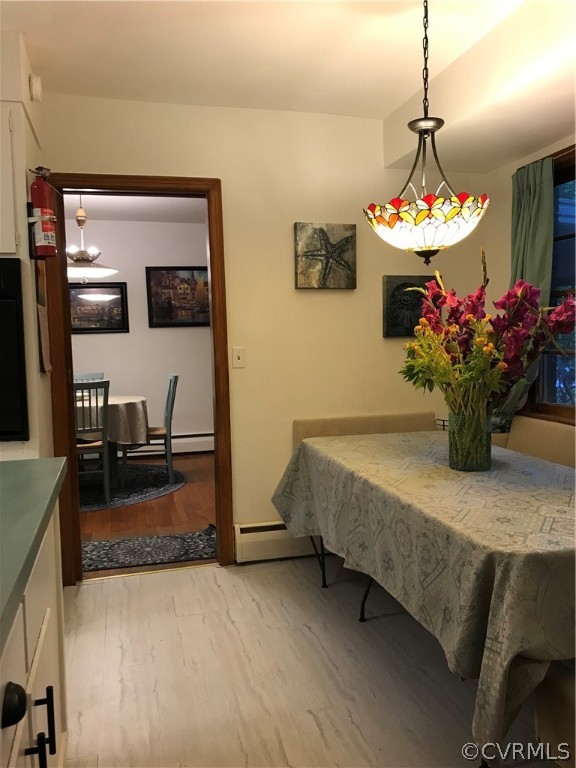 11716 Boyd Road Chester, VA 23831 - Photo 18 of 23 a dining room with furniture and chandelier