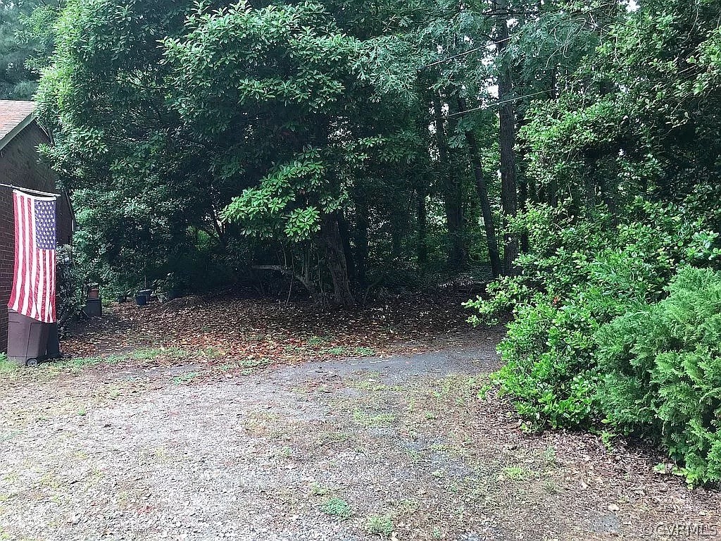 11716 Boyd Road Chester, VA 23831 - Photo 23 of 23 a view of a yard with plants and trees