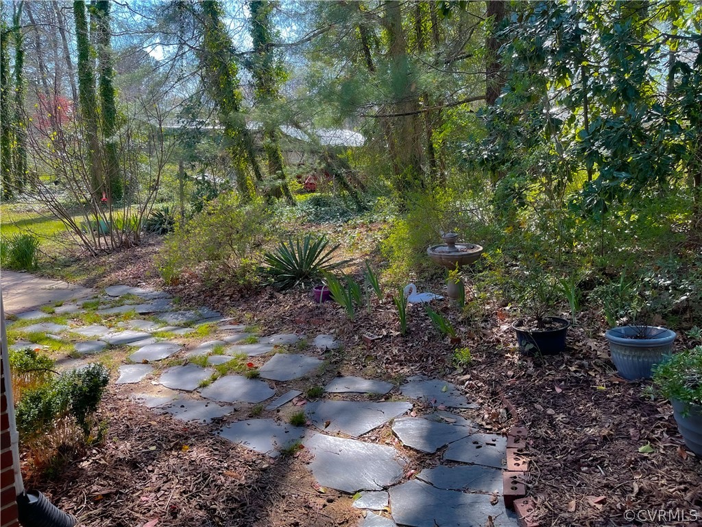 11716 Boyd Road Chester, VA 23831 - Photo 4 of 23 a view of a pathway both side of yard