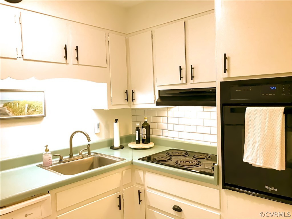 11716 Boyd Road Chester, VA 23831 - Photo 7 of 23 a kitchen with a sink and a stove top oven