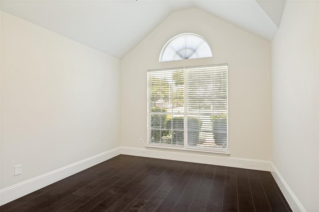 2100 Los Rios Boulevard Plano, TX 75074 - Photo 18 of 25 Vaulted ceiling room featuring dark wood-finish flooring, white baseboards, and a large window with blinds and an arched transom window