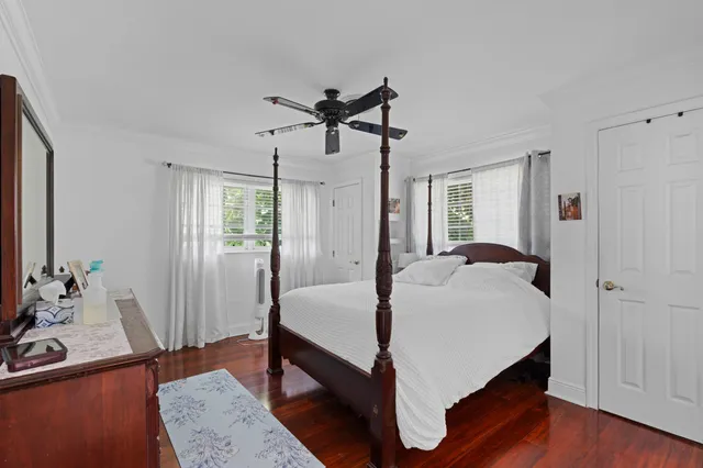 a bathroom with a sink toilet a mirror and shower