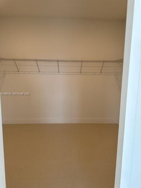 15814 Southwest 136 Way Miami, FL 33196 - Photo 19 of 33 a view of a room with racks on the wall