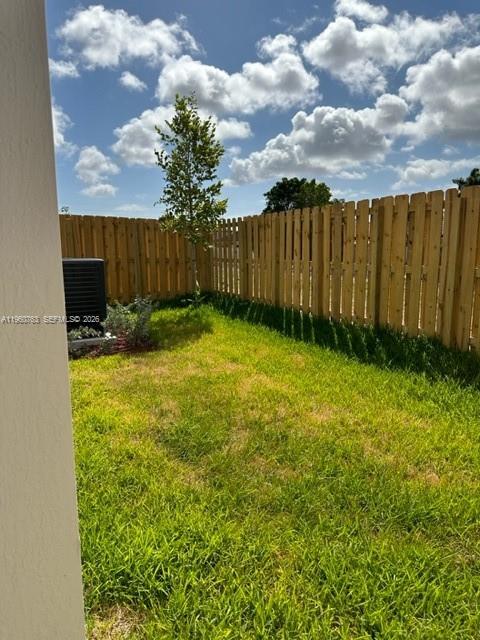 15814 Southwest 136 Way Miami, FL 33196 - Photo 29 of 33 a view of backyard with wooden fence