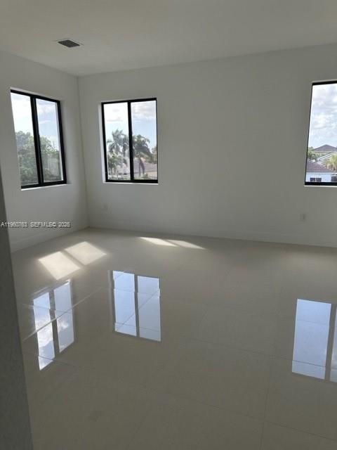 15814 Southwest 136 Way Miami, FL 33196 - Photo 10 of 33 an empty room with windows