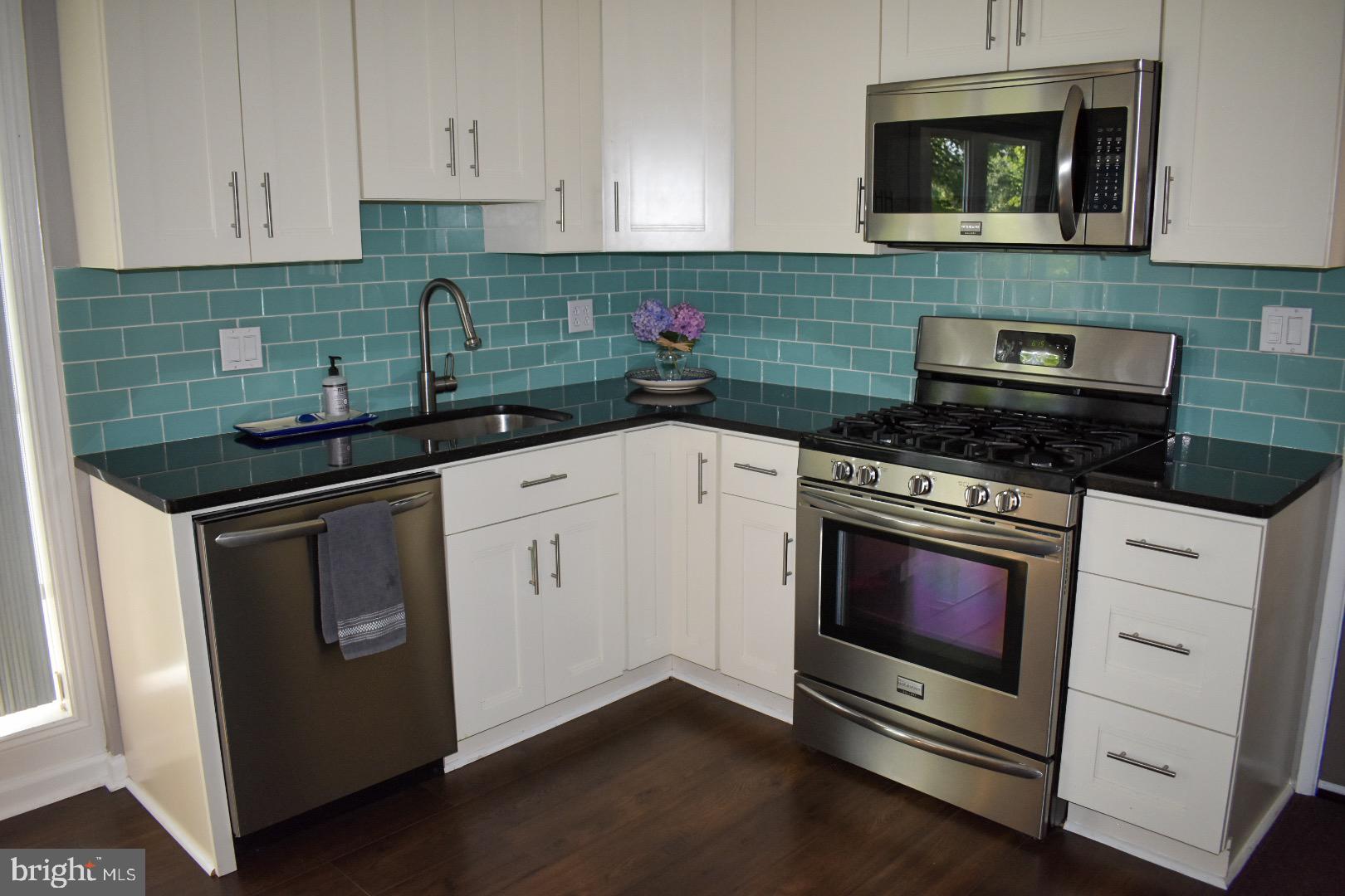 7413 Bath Street Springfield, VA 22150 - Photo 3 of 29 Beautiful custom cabinetry and backsplash