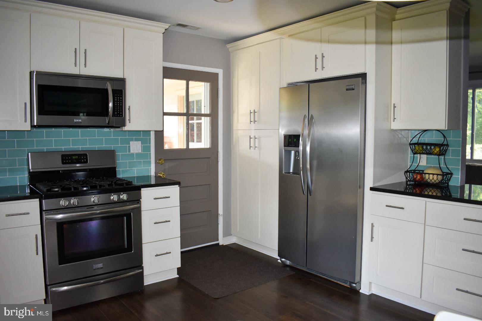 7413 Bath Street Springfield, VA 22150 - Photo 4 of 29 Stainless steel appliances and cabinet space