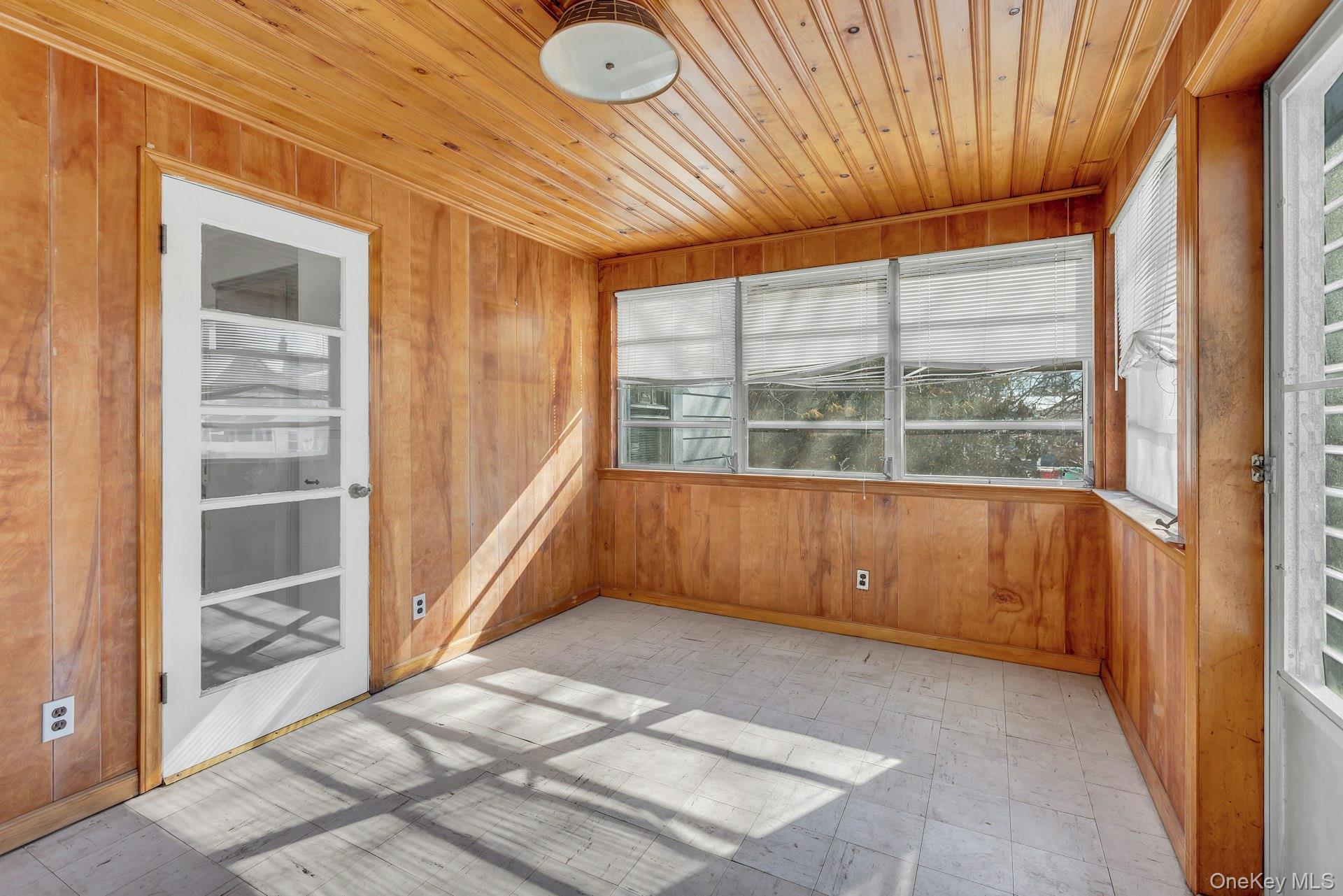 463 South 3rd Street Lindenhurst, NY 11757 - Photo 12 of 24 a view of empty room with wooden floor and fan