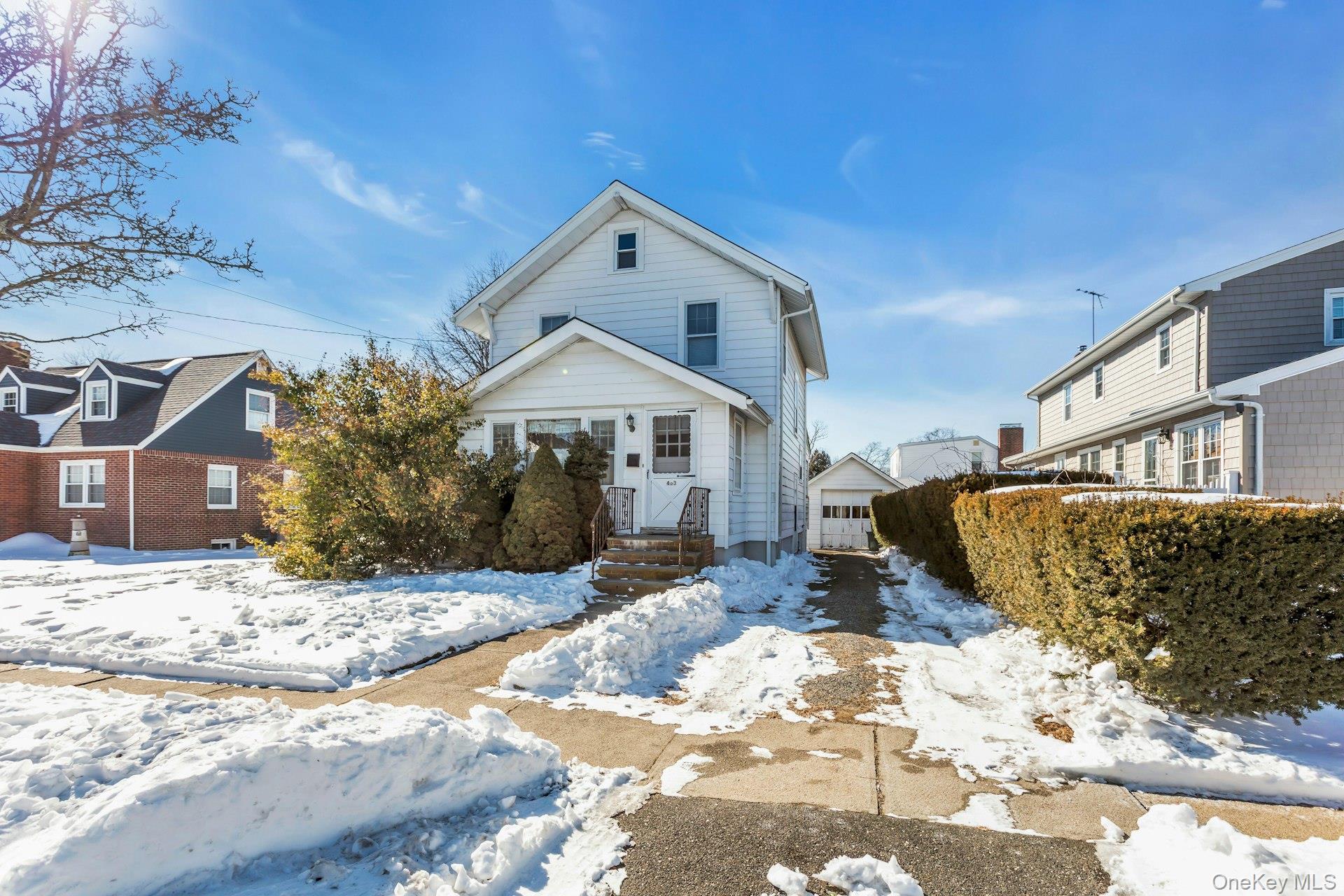 463 South 3rd Street Lindenhurst, NY 11757 - Photo 2 of 24 a front view of a house with a yard