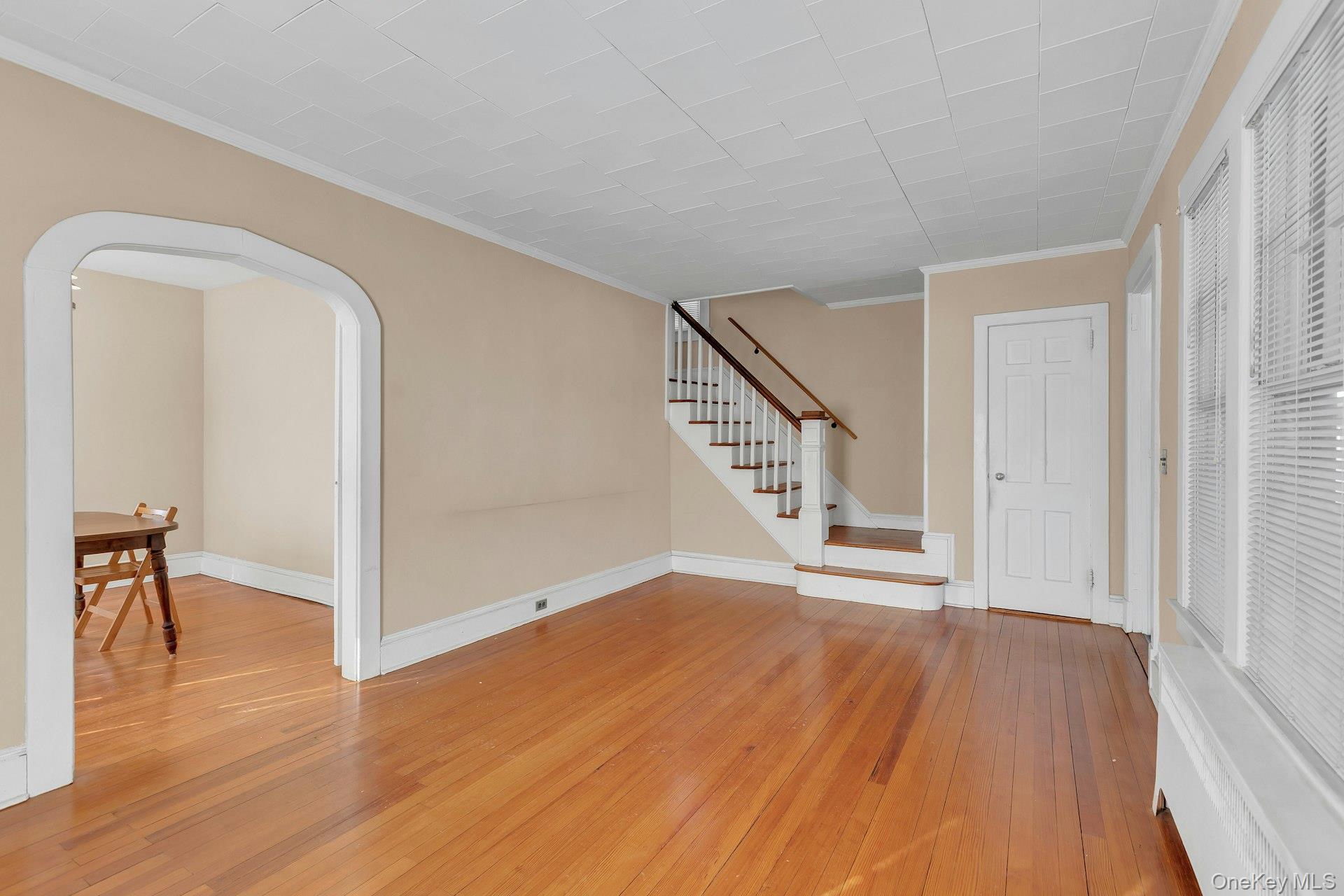 463 South 3rd Street Lindenhurst, NY 11757 - Photo 6 of 24 a view of a hallway view with wooden floor and staircase