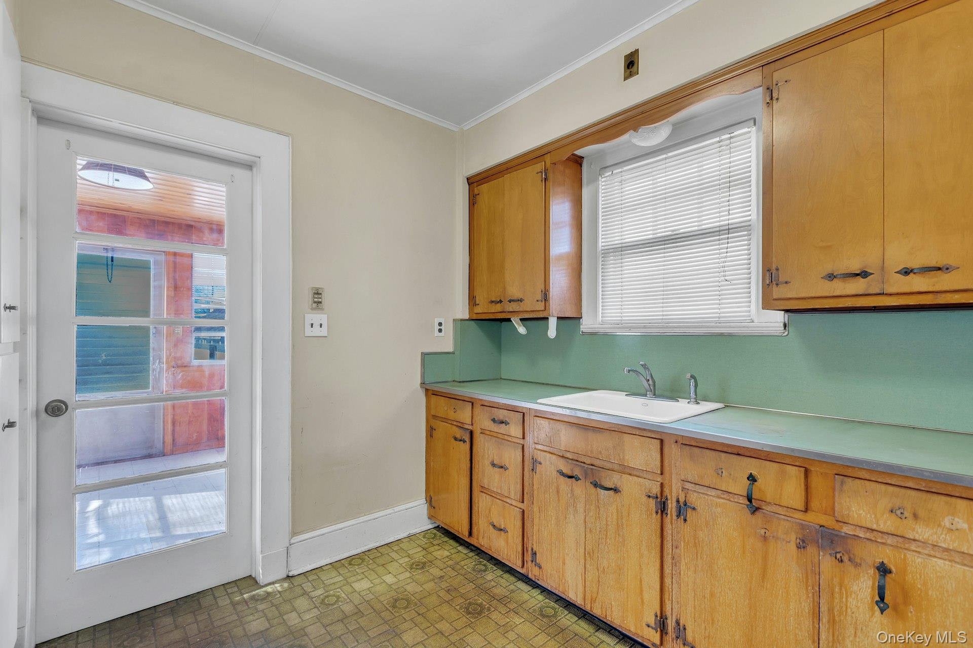 463 South 3rd Street Lindenhurst, NY 11757 - Photo 8 of 24 a kitchen with stainless steel appliances granite countertop white cabinets and a sink