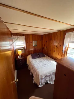 a bed sitting in a room next to a window