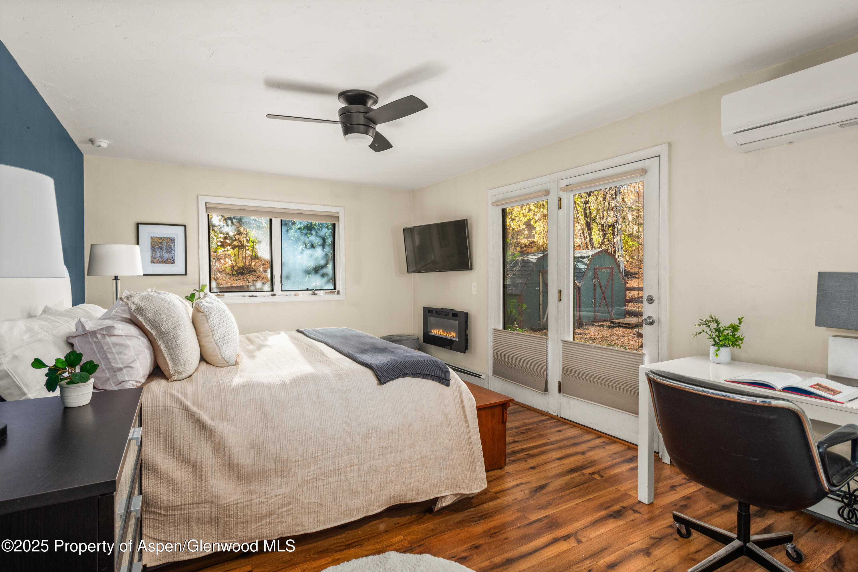 106 Swinging Bridge Lane Basalt, CO 81621 - Photo 5 of 10 a bedroom with a bed and wooden floor