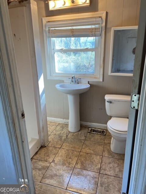 6 Derrick Avenue Hampton, GA 30228 - Photo 11 of 12 a bathroom with a toilet sink and window