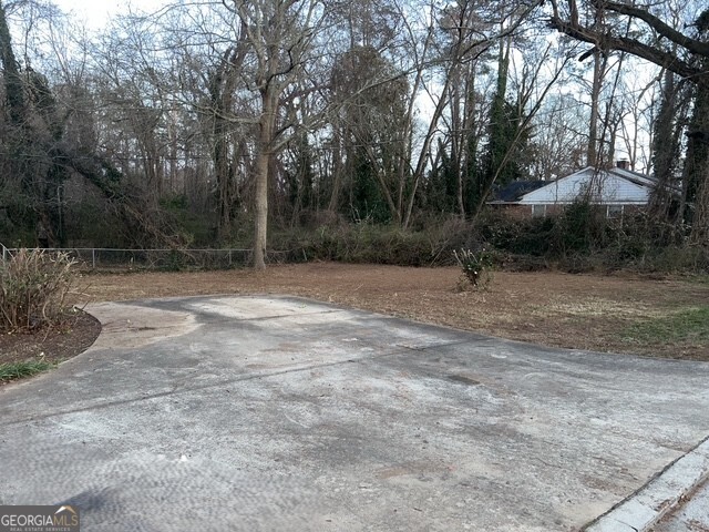6 Derrick Avenue Hampton, GA 30228 - Photo 3 of 12 a view of outdoor space with trees