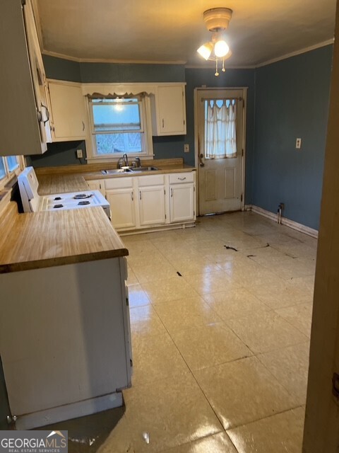 6 Derrick Avenue Hampton, GA 30228 - Photo 9 of 12 a kitchen with a sink cabinets and window