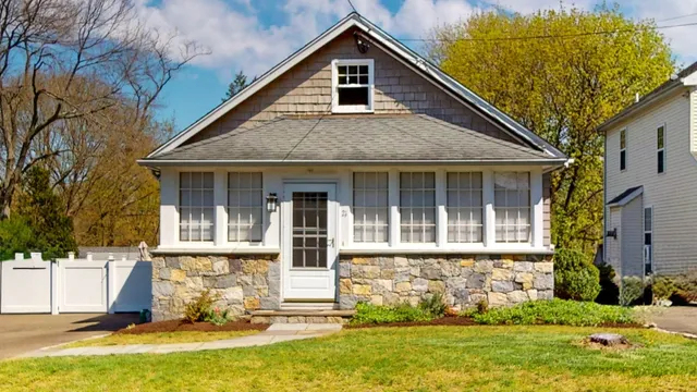 front view of a house with a yard