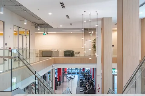 a living room with lots of table and chair
