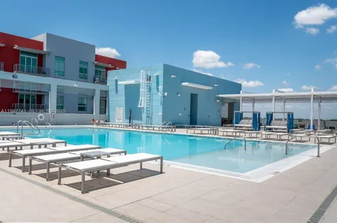 a room with lots of chairs and mirrors