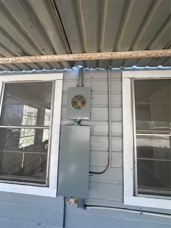a bathroom with a glass shower door