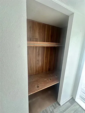 an empty room with wooden floor