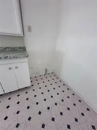 a bathroom with a granite countertop sink