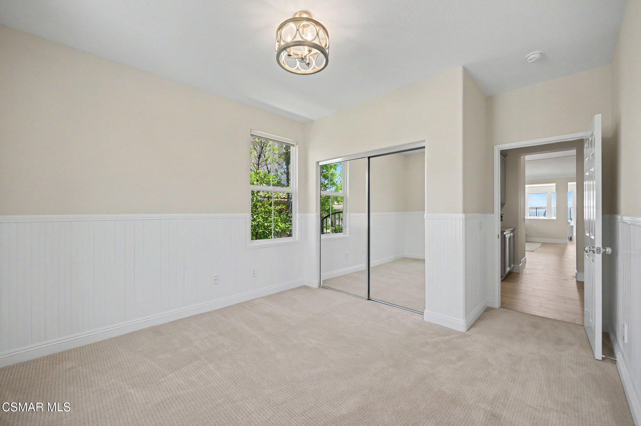 20800 Sardinia Way Porter Ranch, CA 91326 - Photo 23 of 57 an empty room with windows and closet