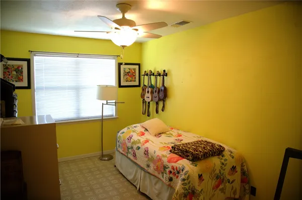 a bedroom with a bed and a table in it