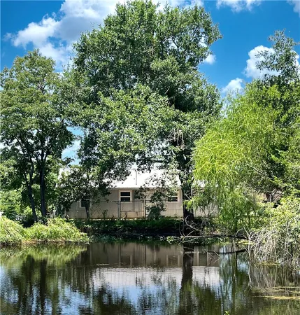 a view of a large body of water surrounded by trees