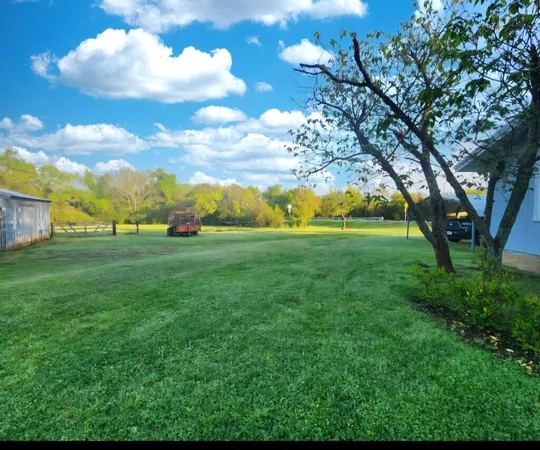 a view of yard with outdoor seating