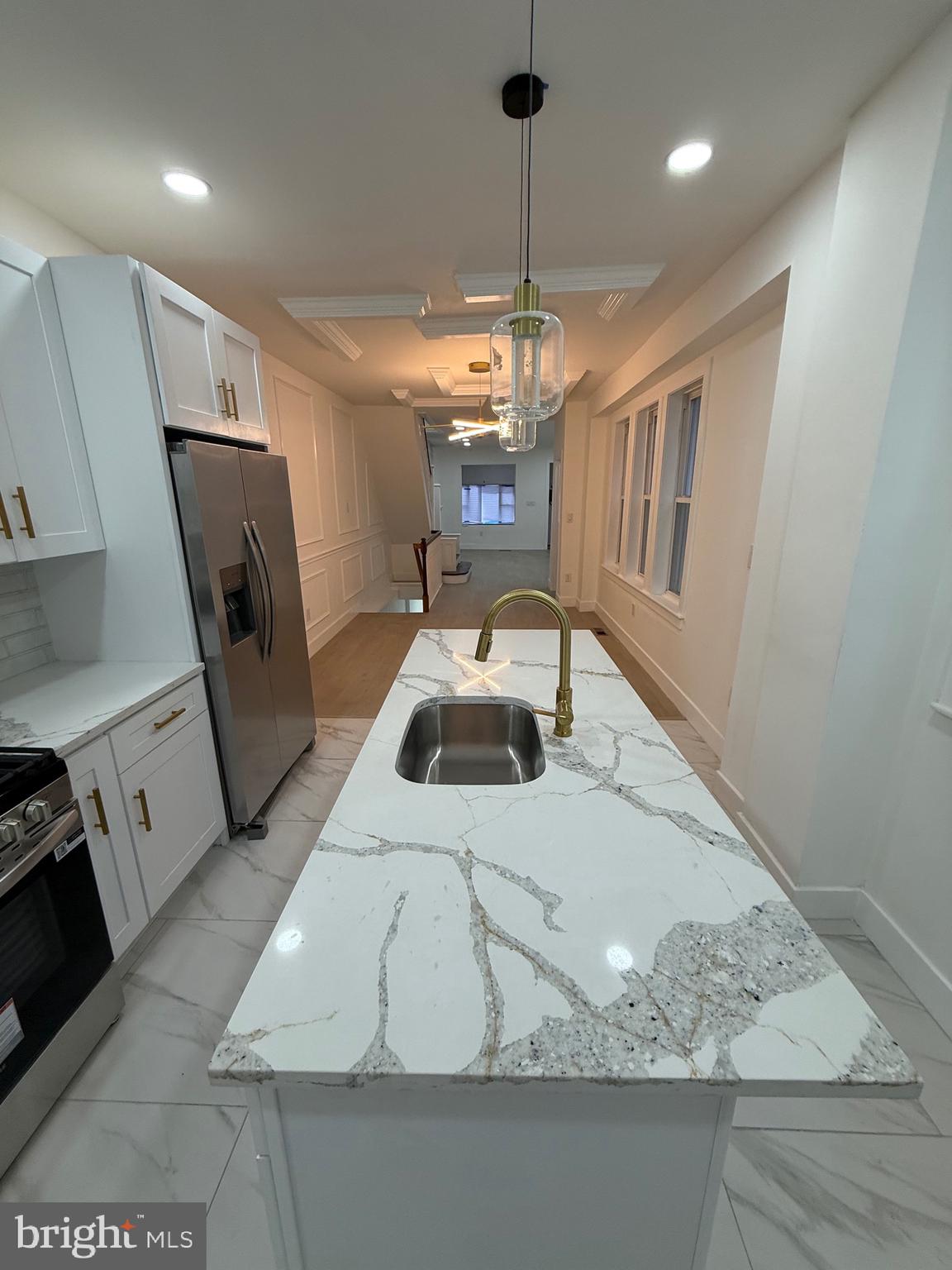 5908 Christian Street Philadelphia, PA 19143 - Photo 12 of 41 a kitchen with a sink a stove and refrigerator