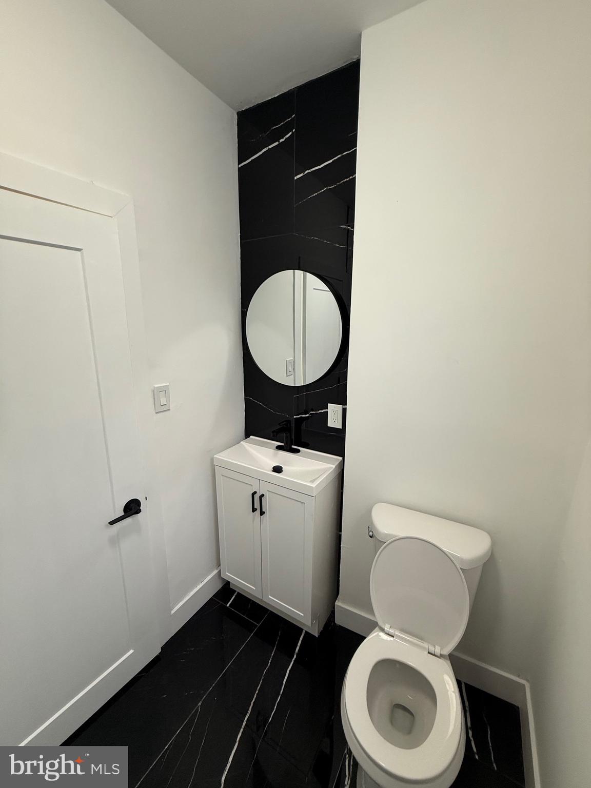 5908 Christian Street Philadelphia, PA 19143 - Photo 21 of 41 a bathroom with a toilet and a sink