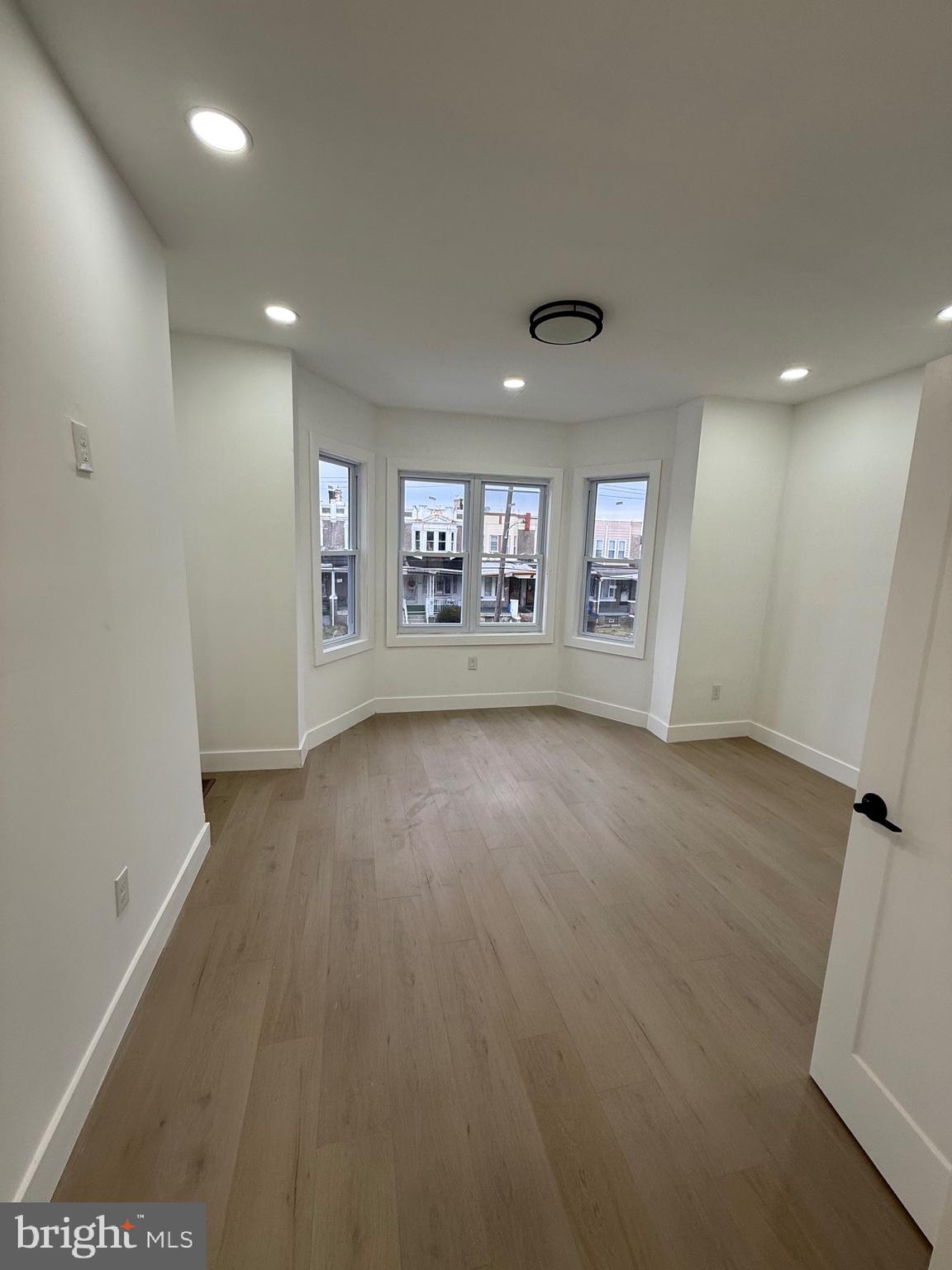 5908 Christian Street Philadelphia, PA 19143 - Photo 22 of 41 an empty room with a empty space and windows