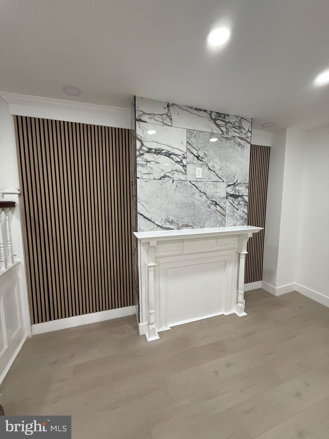 5908 Christian Street Philadelphia, PA 19143 - Photo 32 of 41 a view of a livingroom with wooden floor and a ceiling fan