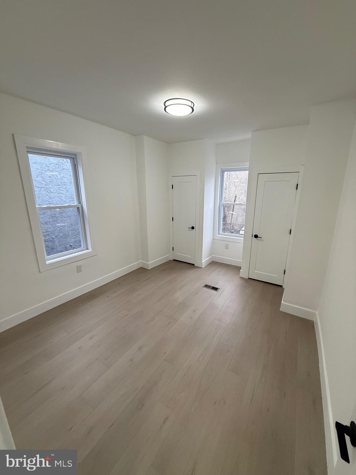 5908 Christian Street Philadelphia, PA 19143 - Photo 34 of 41 an empty room with a empty space and windows