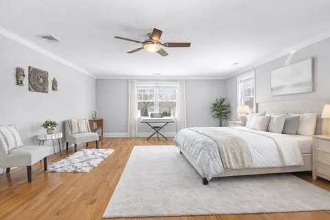 a spacious bedroom with a large bed and a couch
