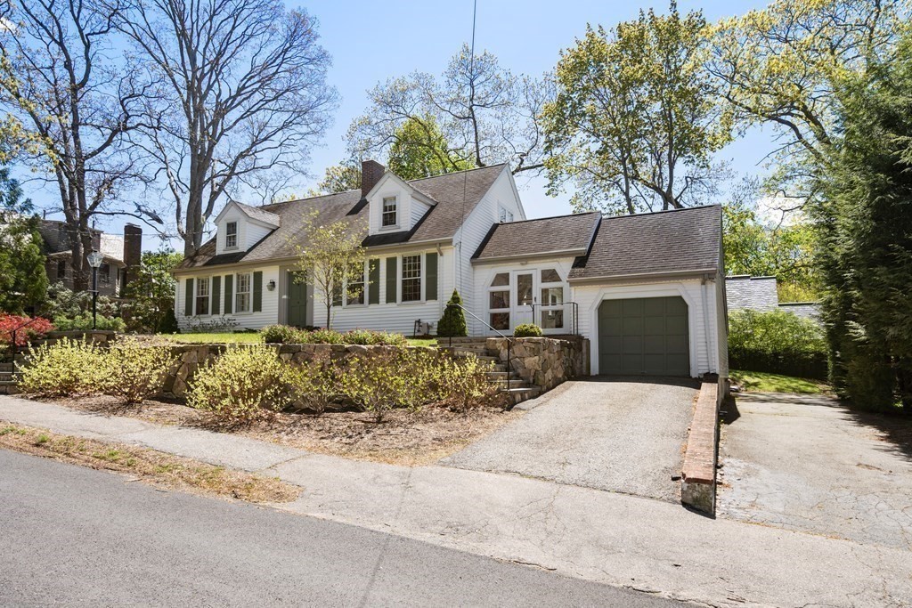 12 Puritan Road Newton, MA 02461 - Photo 36 of 39 a front view of a house with a yard
