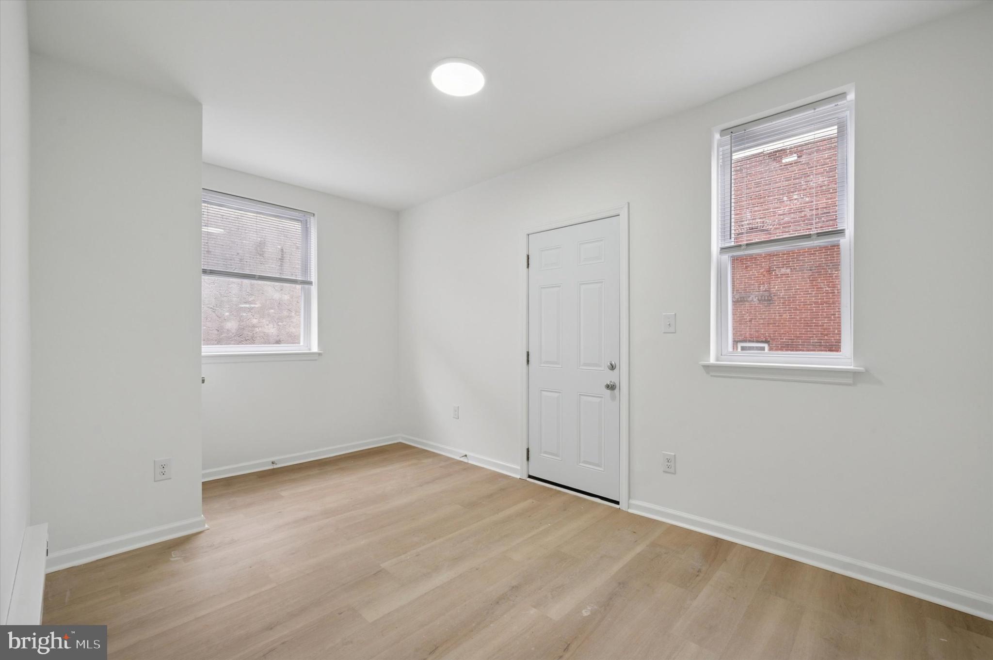 5431 Walnut Street, Unit 2 Philadelphia, PA 19139 - Photo 3 of 6 an empty room with windows
