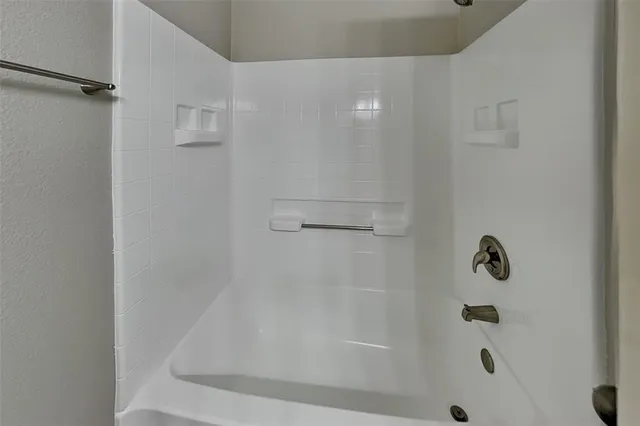 a close view of a bathtub in bathroom
