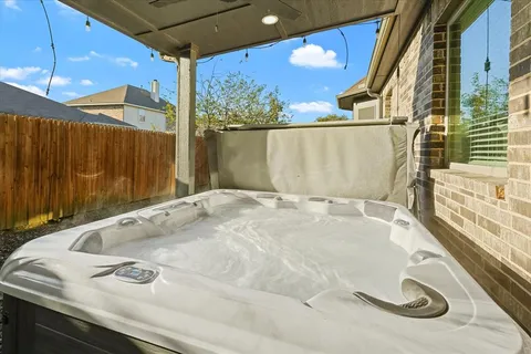 a bathroom with a tub and a sink