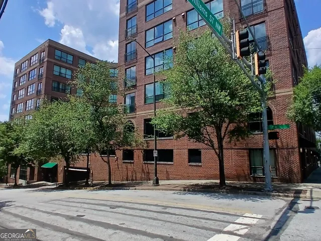 a view of a building with a street