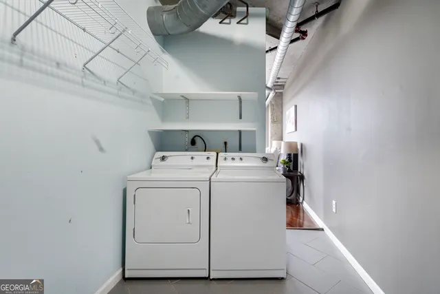 a utility room with dryer and washer