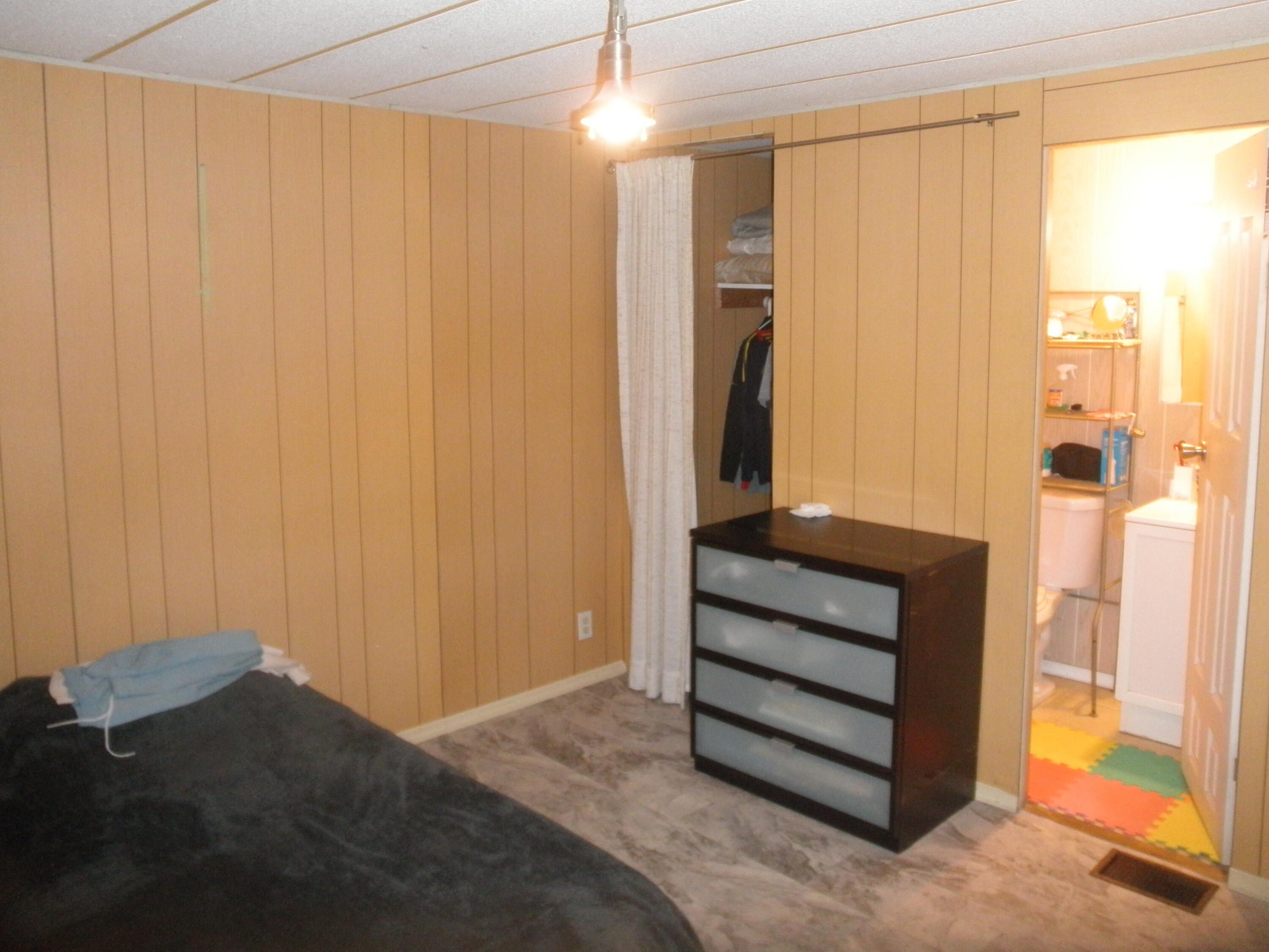 4544 Sunset Ranch Road West Palm Beach, FL 33415 - Photo 4 of 10 a view of a room with wooden walls and windows