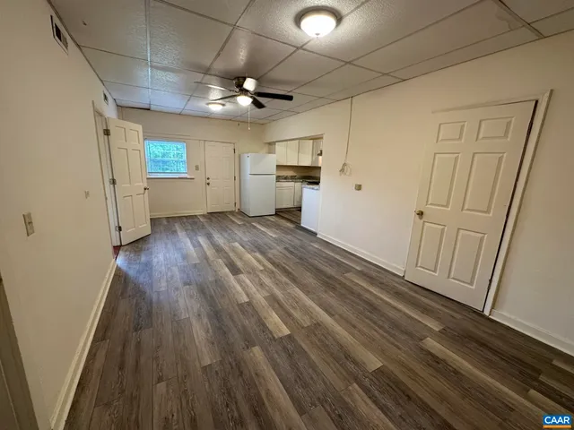 a view of a livingroom with wooden floor